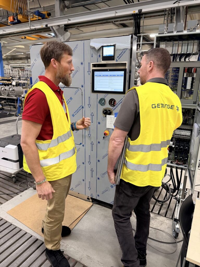 Amicus consultant reviewing equipment controls on site