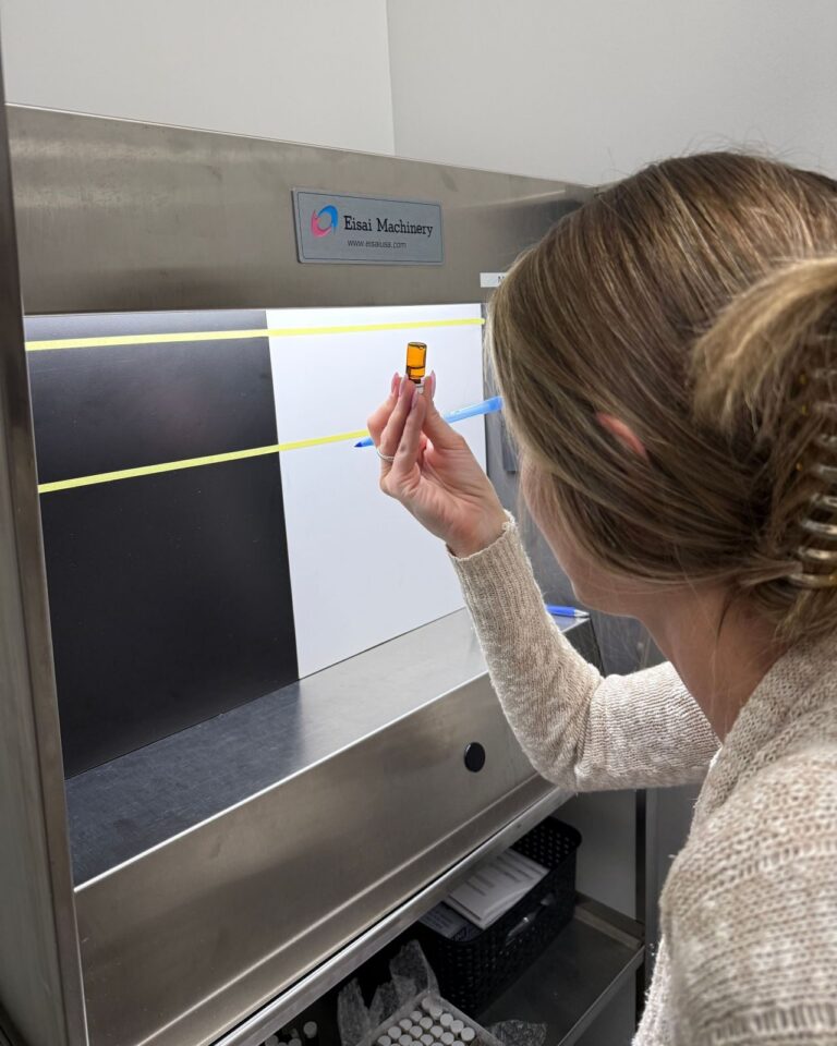 Amicus consultant performing a visual inspection of a filled vial